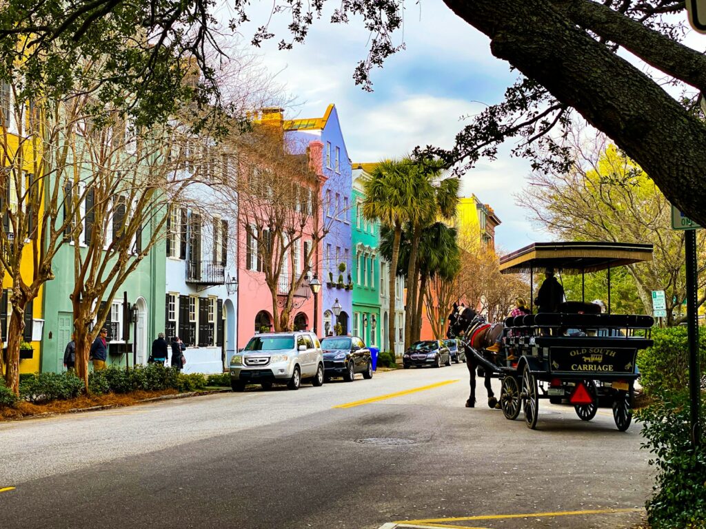 people riding on carriage on road during daytime in Charleston SC